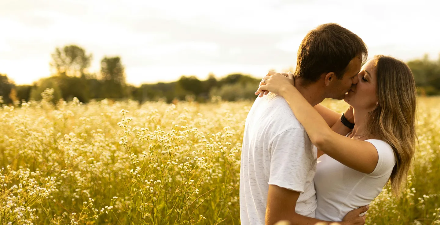 Couple embracing in a flower field